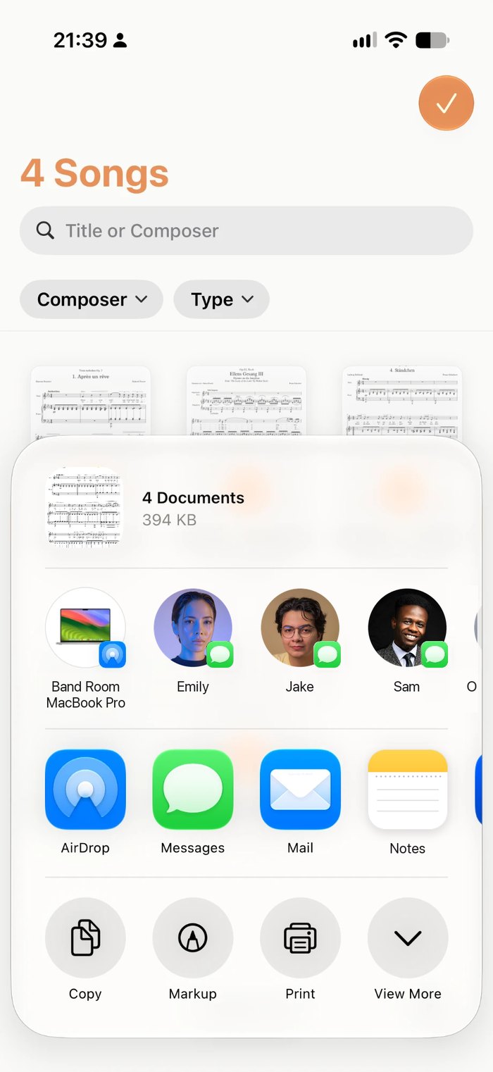 The share sheet in Music Folder on iPhone, sending four songs with AirDrop, Messages or Mail