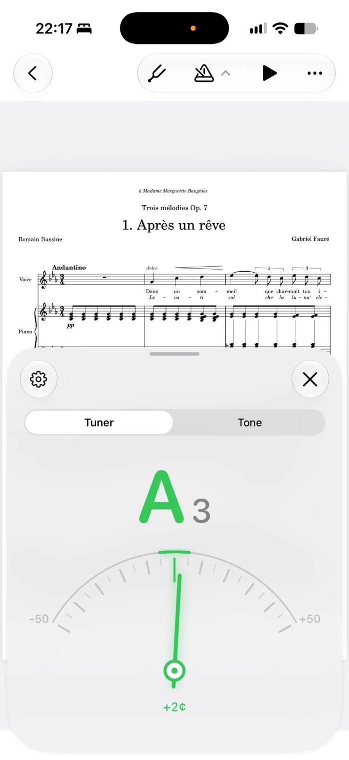 The tuner open over a score in Music Folder on iPhone, showing A3 two cents sharp